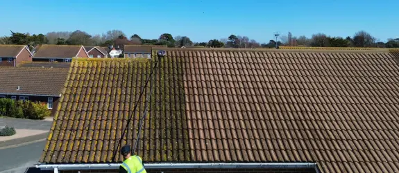 before and after photo of roof cleaning in Frome Vale, Northern Ireland